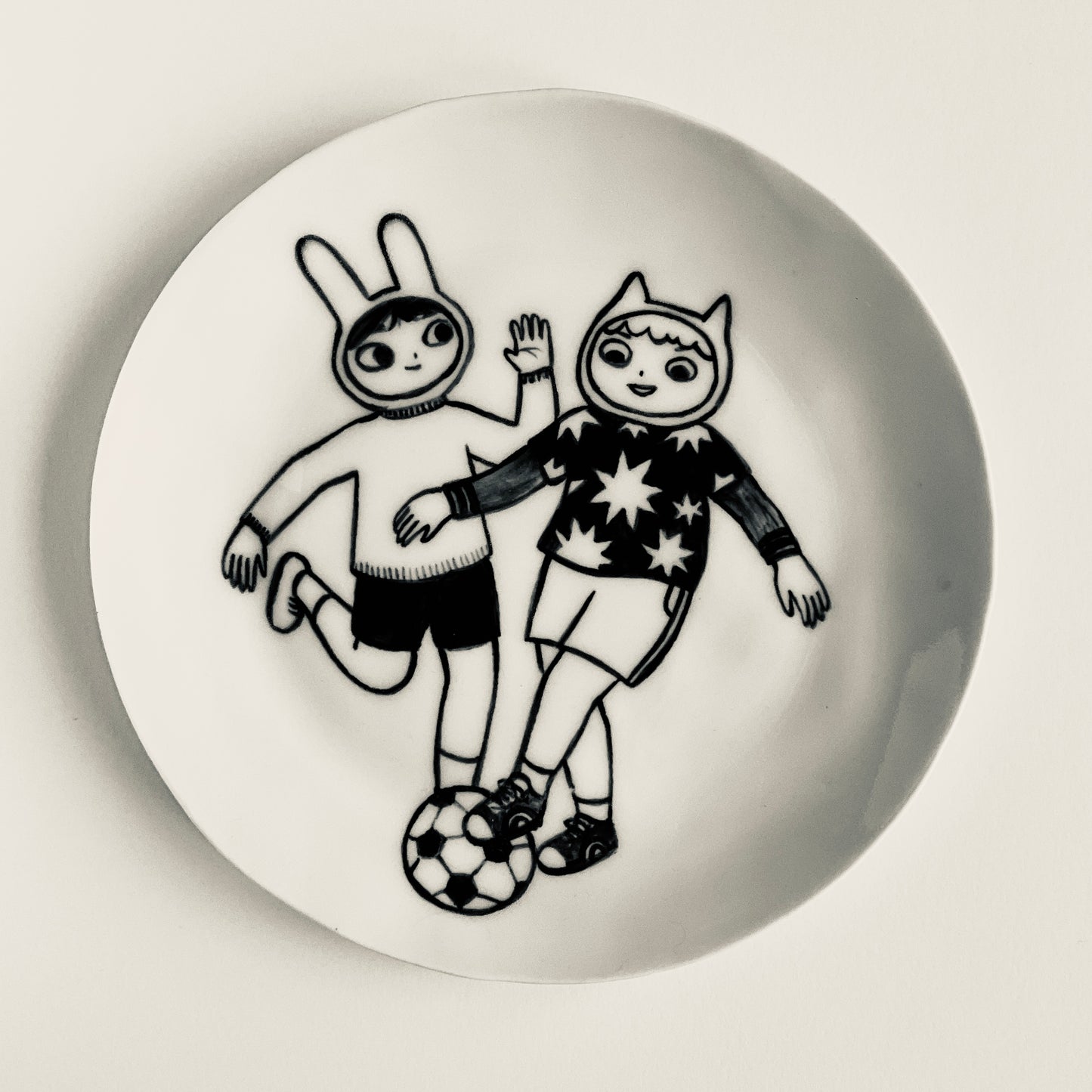 Bunny and Cat have a Kick About plate