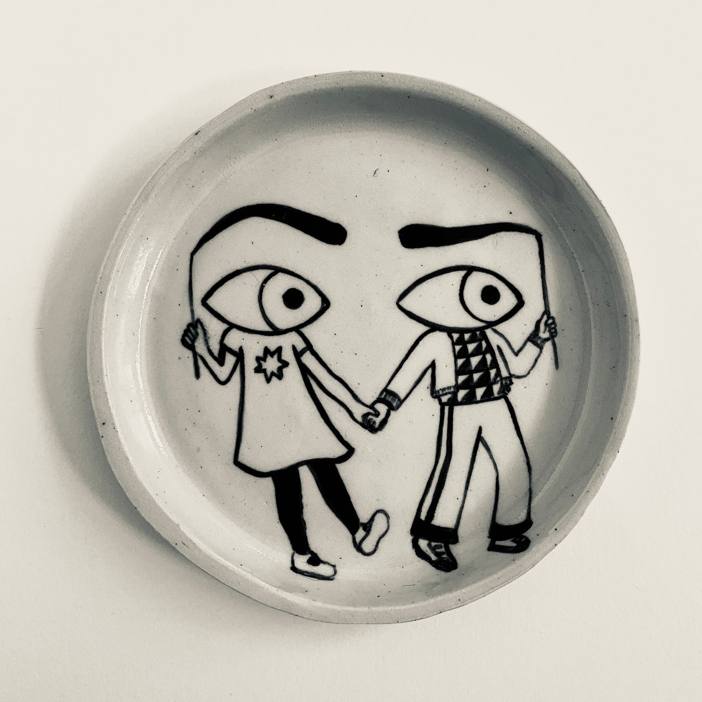 Friends dressed as Sceptical Eyes plate