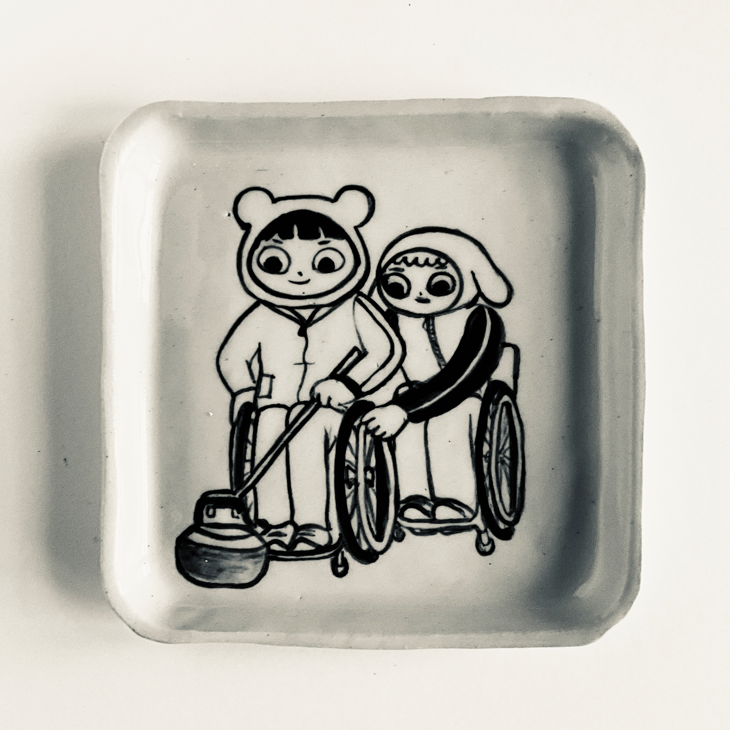 Bear and Flopsy try Wheelchair Curling plate