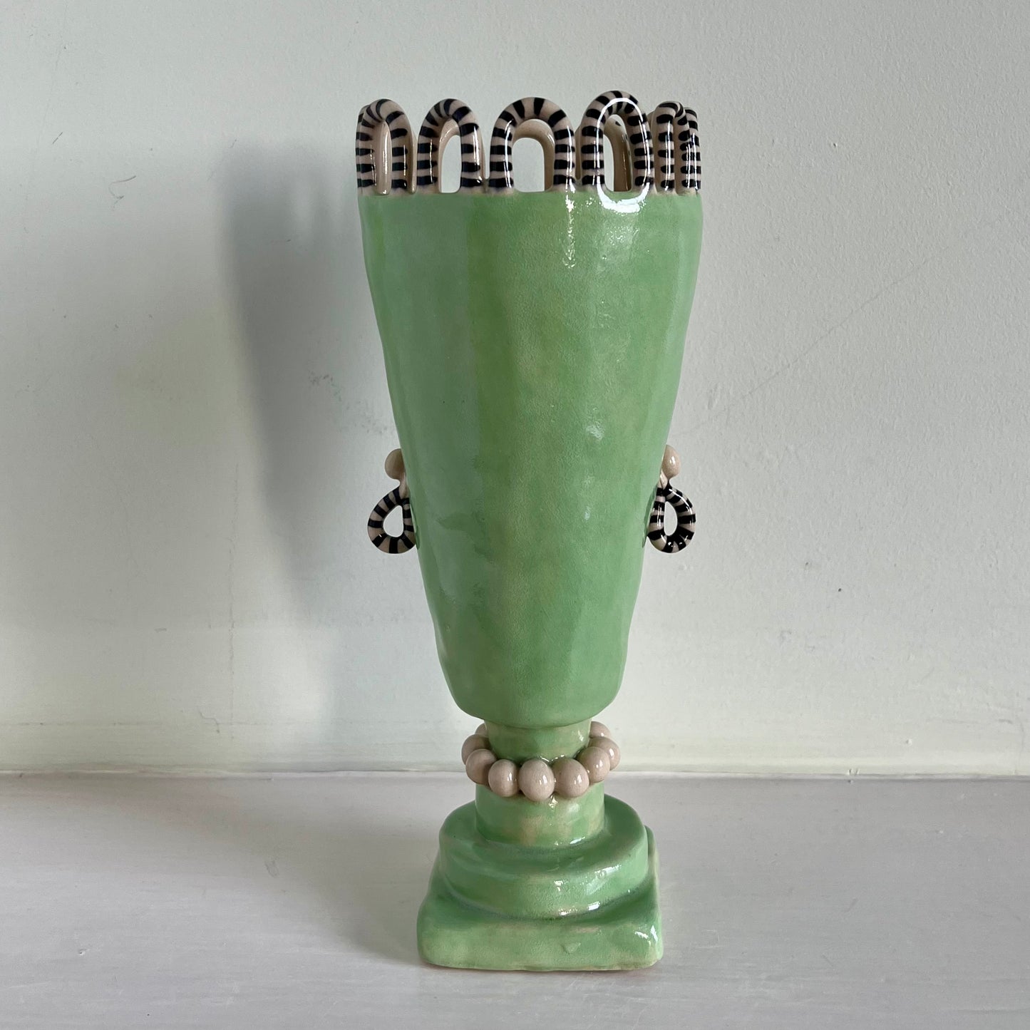 Parakeet Green and Black Tall Vase with Pearl Necklace and Stripy Looped Crown