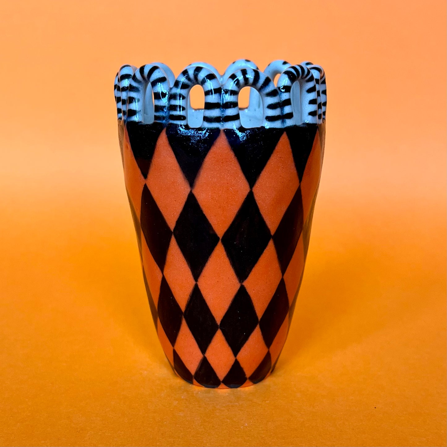 Orange and Black Harlequin with a Stripy Looped Crown