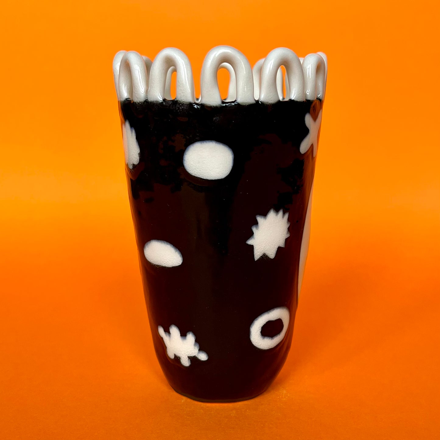 Porcelain Black and White Shapes with a White Looped Crown