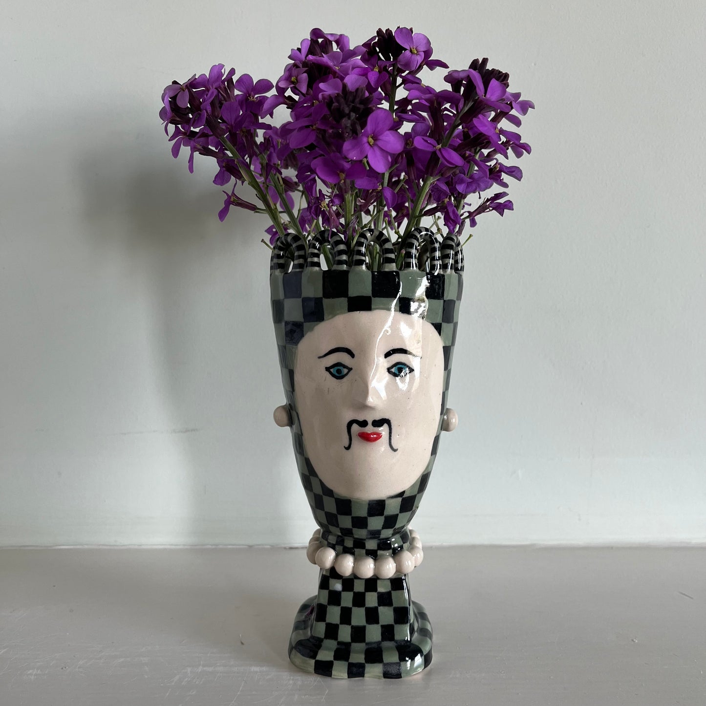 Tall Green Checkered Man with Jewellery