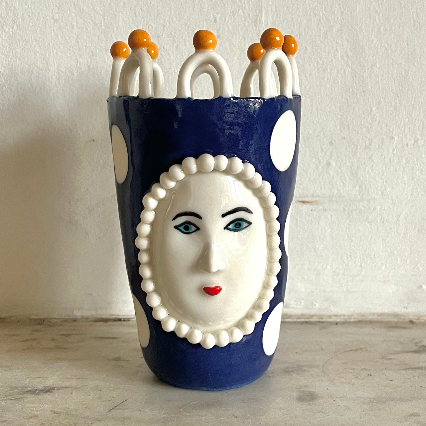 Porcelain Lady with Large White Dots on Blue