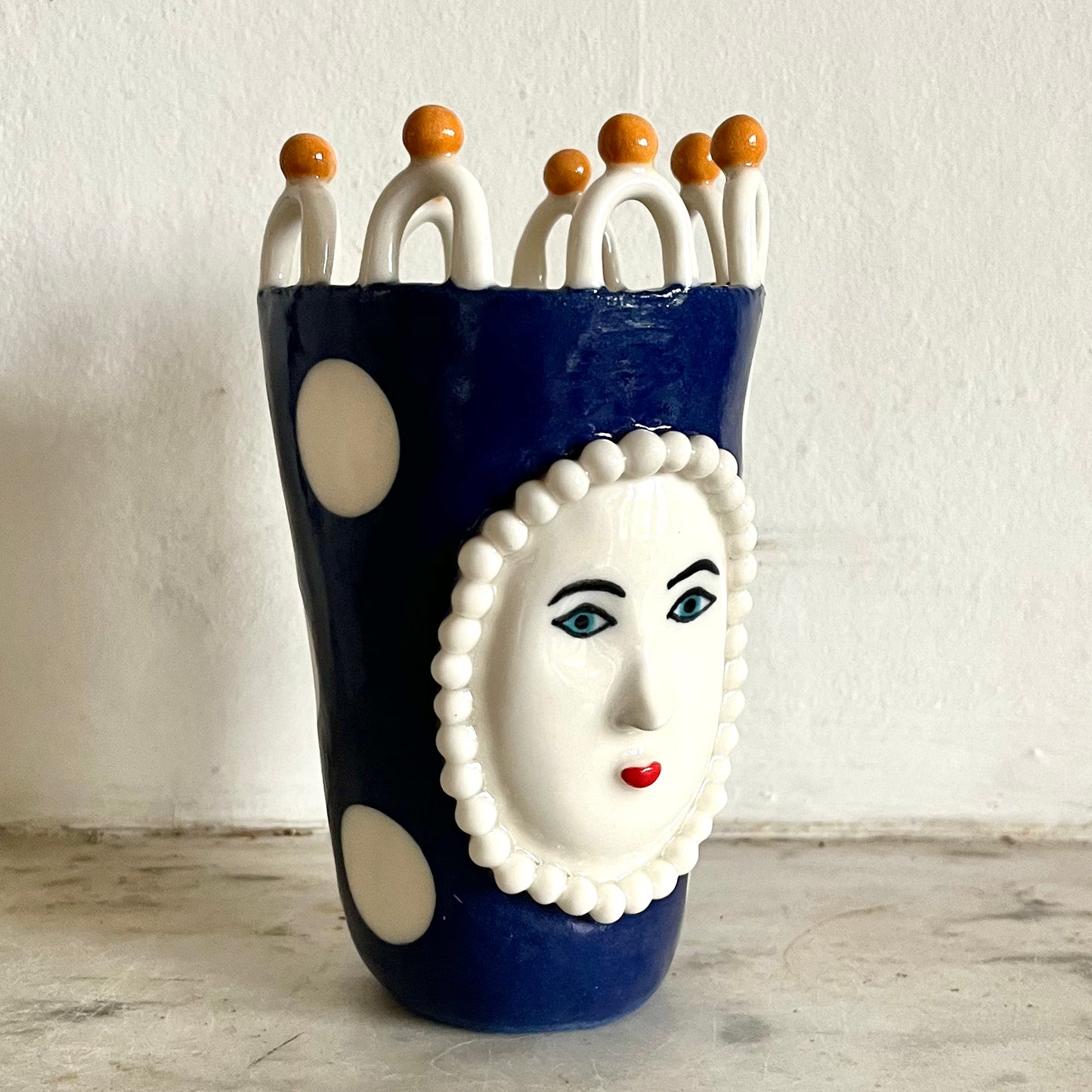 Porcelain Lady with Large White Dots on Blue