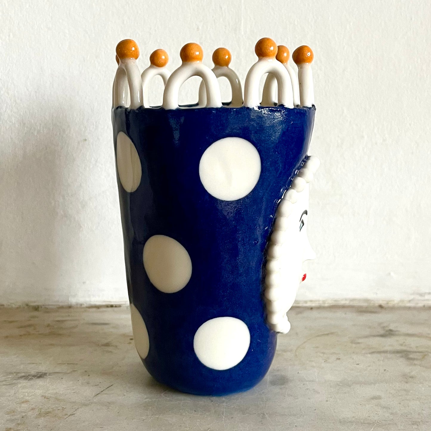 Porcelain Lady with Large White Dots on Blue