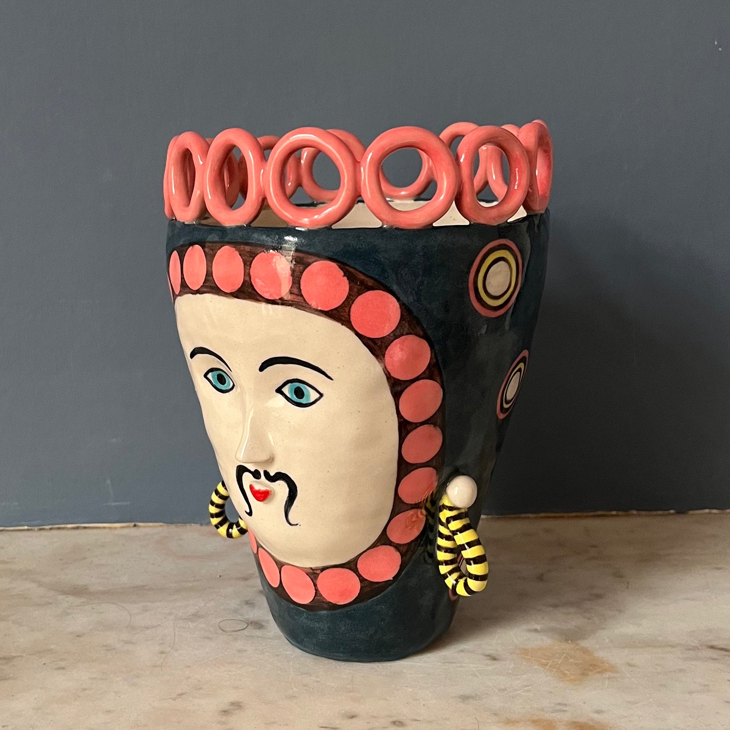 Moody Blue Man with Pink Circle Crown