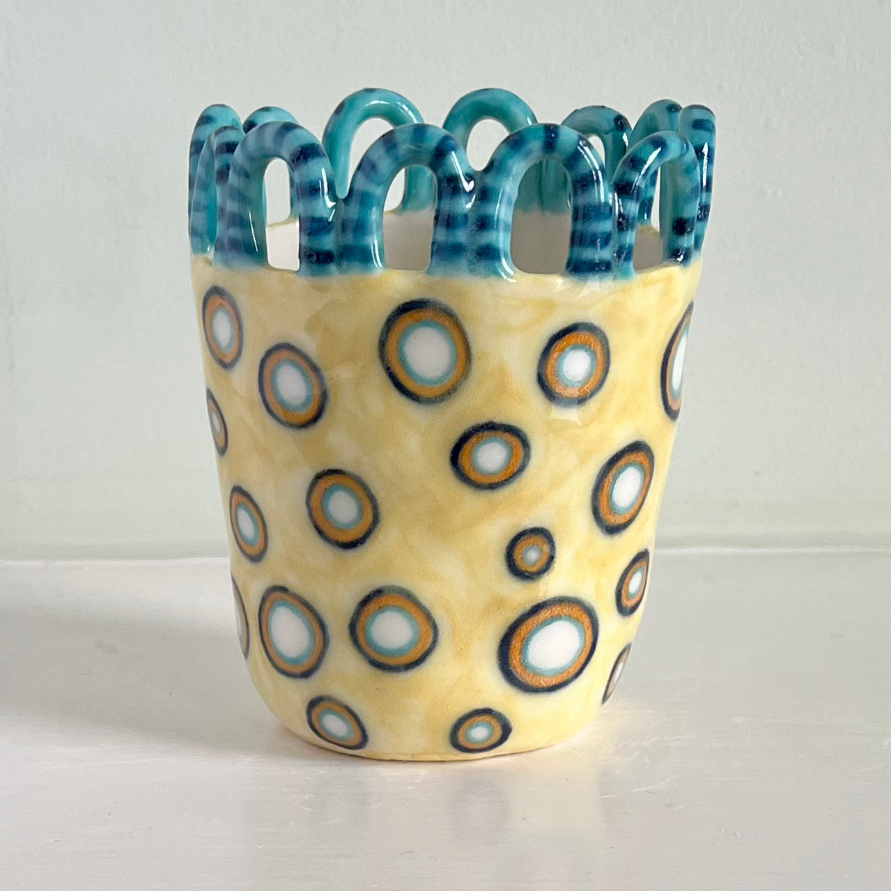 Porcelain Stripy Turquoise Looped Man with White Dots on Honeydew Yellow