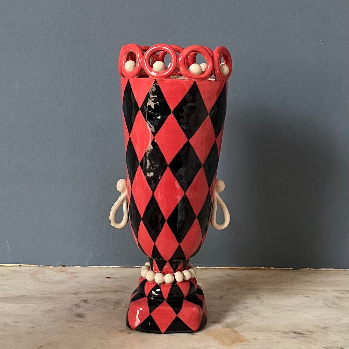 Red and Black Harlequin Head Pot with Droplet Earrings, Moustache and a Pearly Ringed Crown