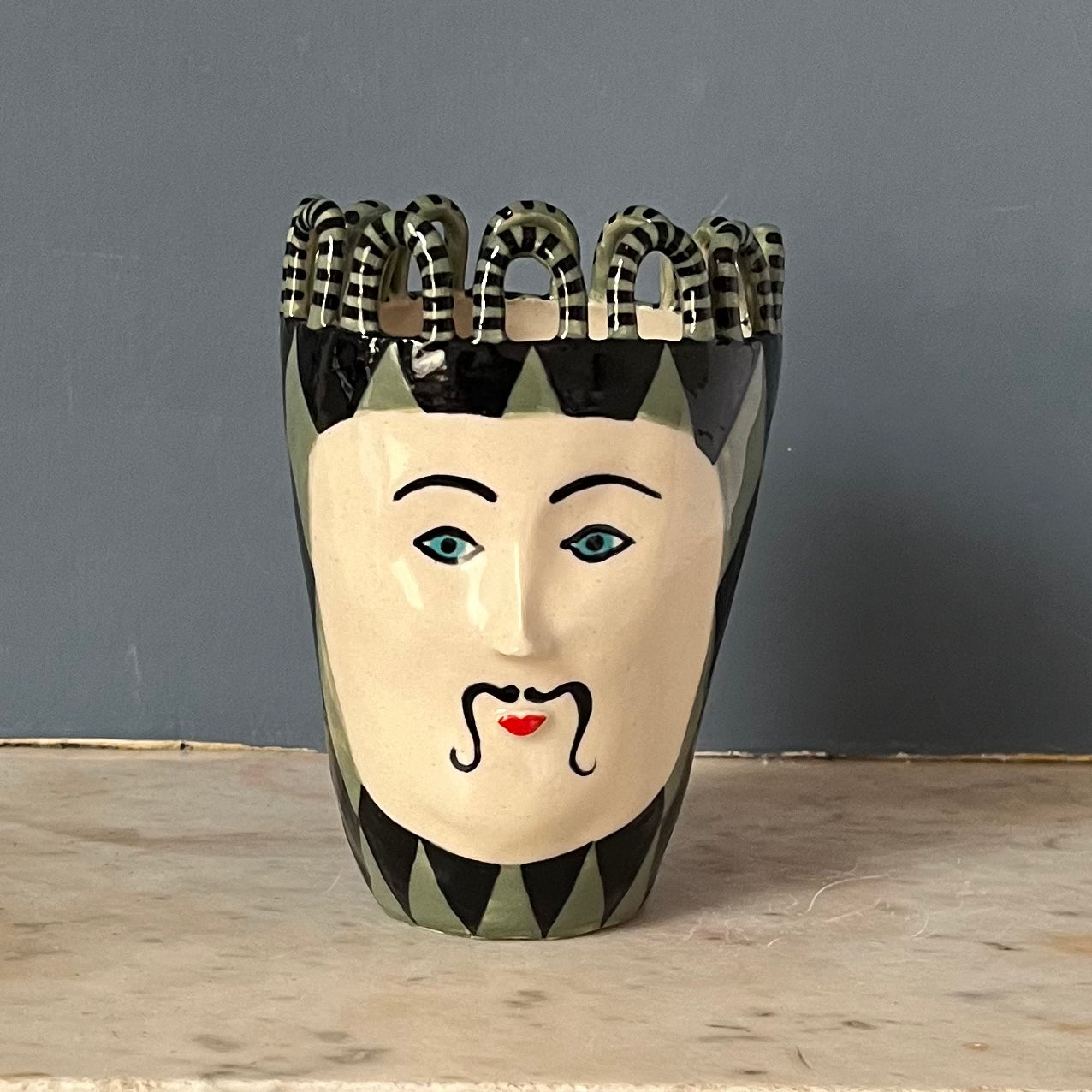 Green and Black Harlequin Man