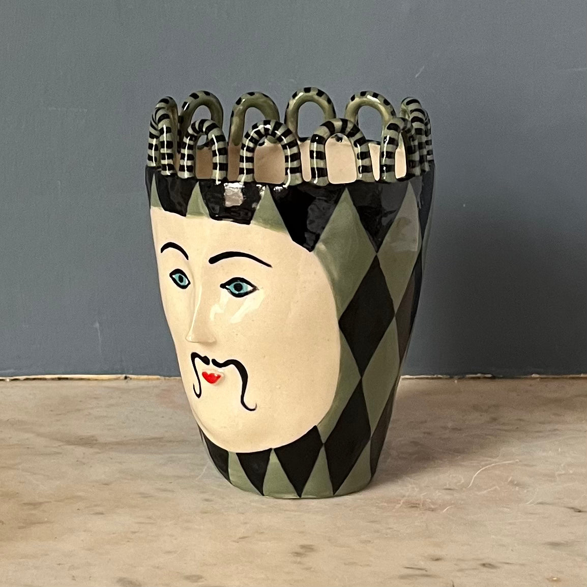 Green and Black Harlequin Man