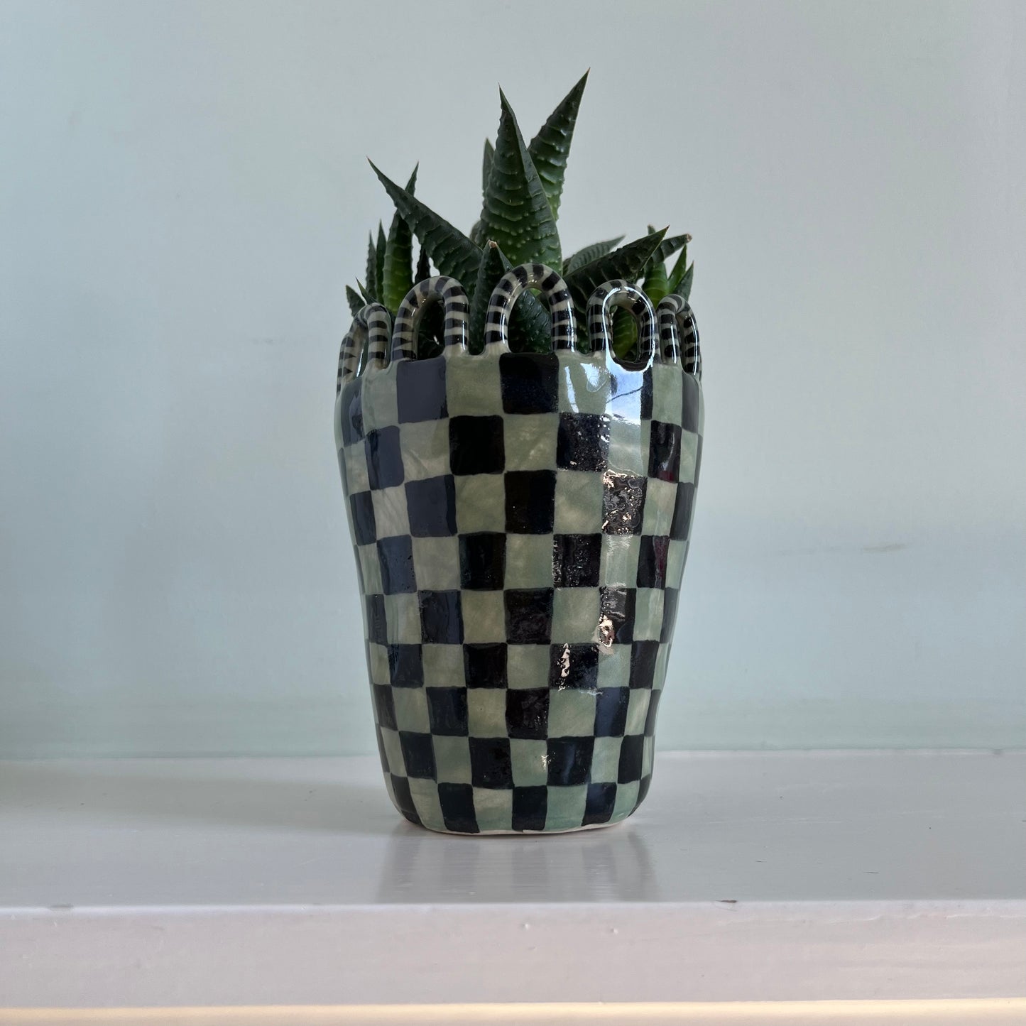 Green and Black Checkered Man