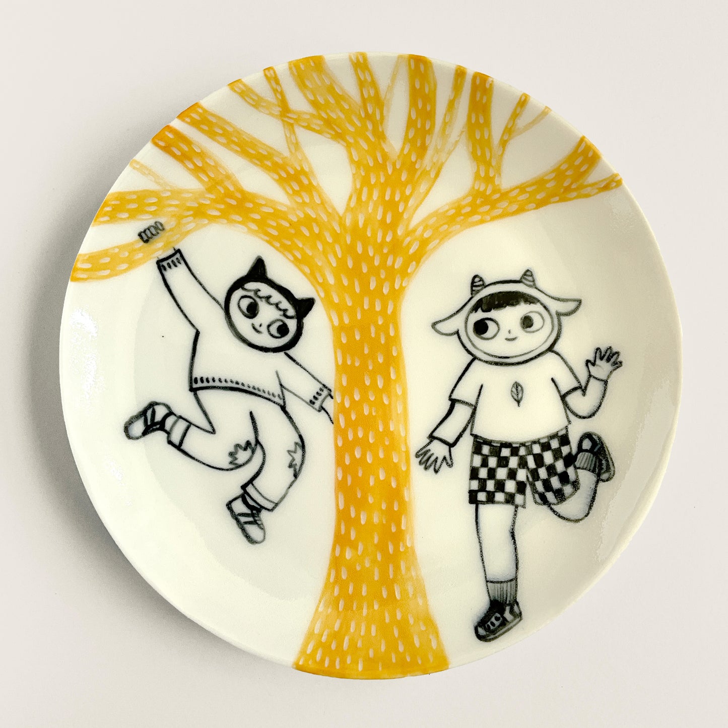Cat and Goat play under a Yellow Tree plate