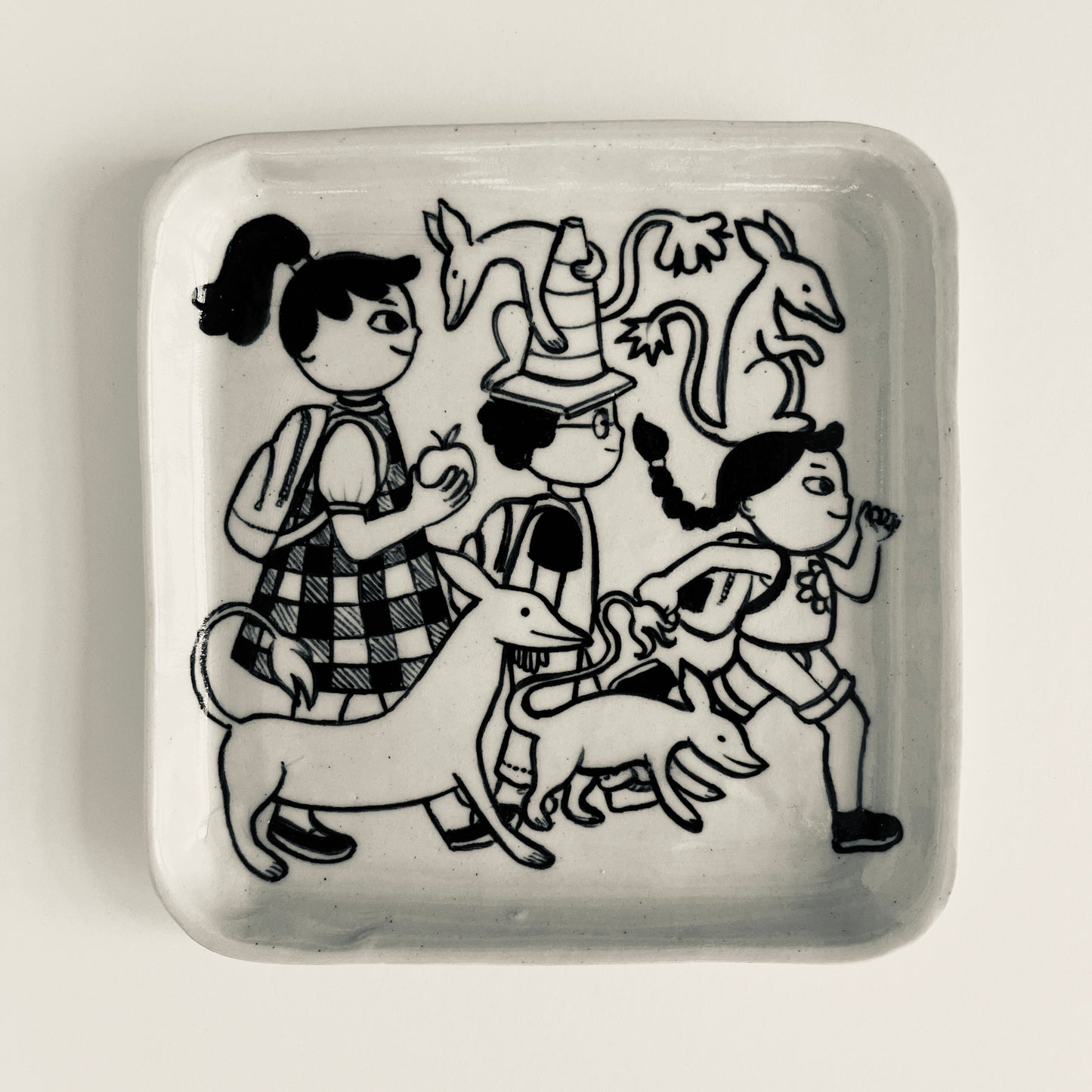 Three Siblings Walk to School with their Animal Friends plate