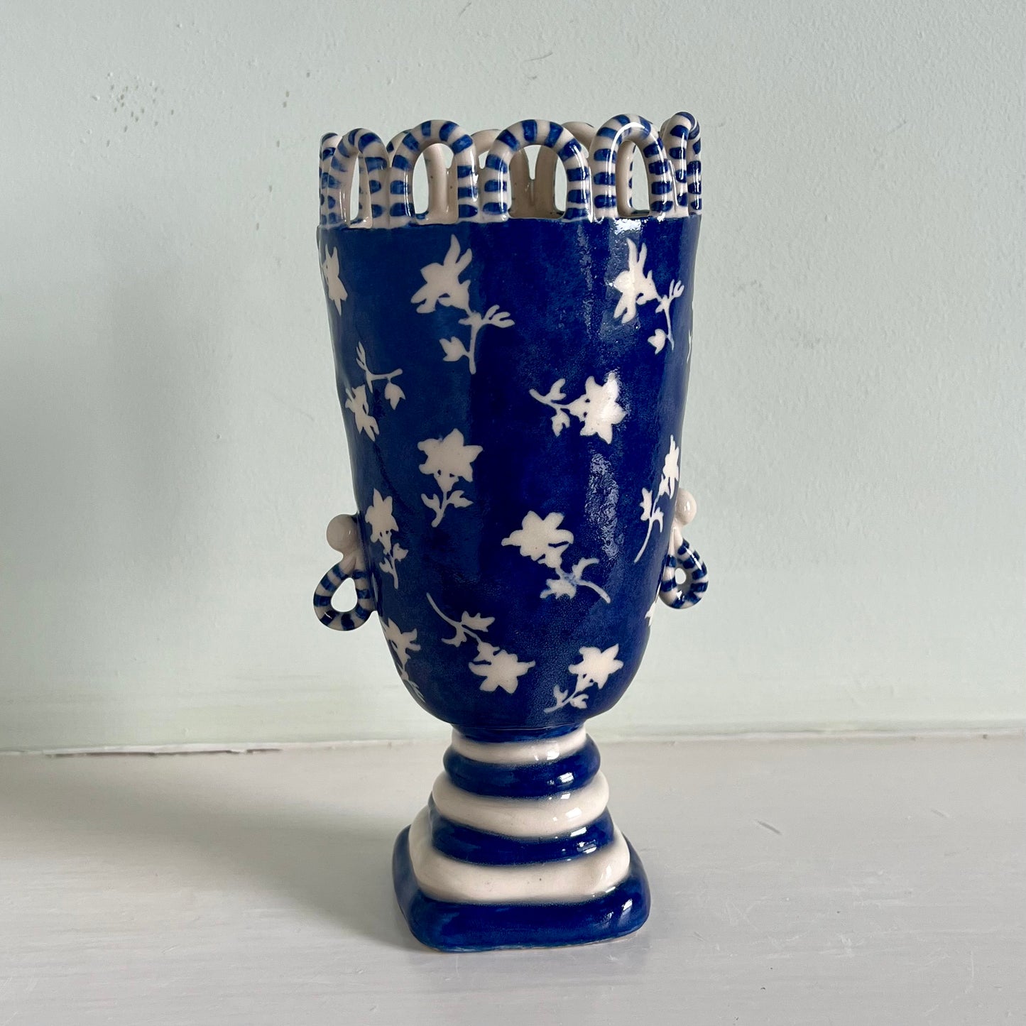 White Flowers on Blue Tall Lady with Stripy Hooped Crown and Looped Earrings