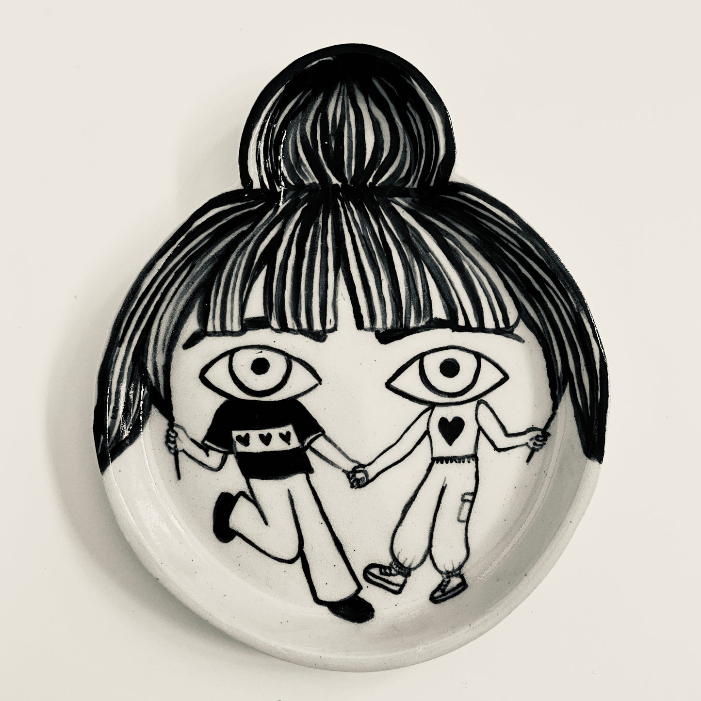 Friends dressed as Eyes and Fringe plate