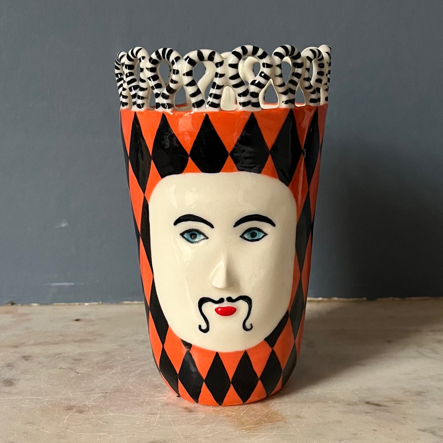 Orange and Black Harlequin Man