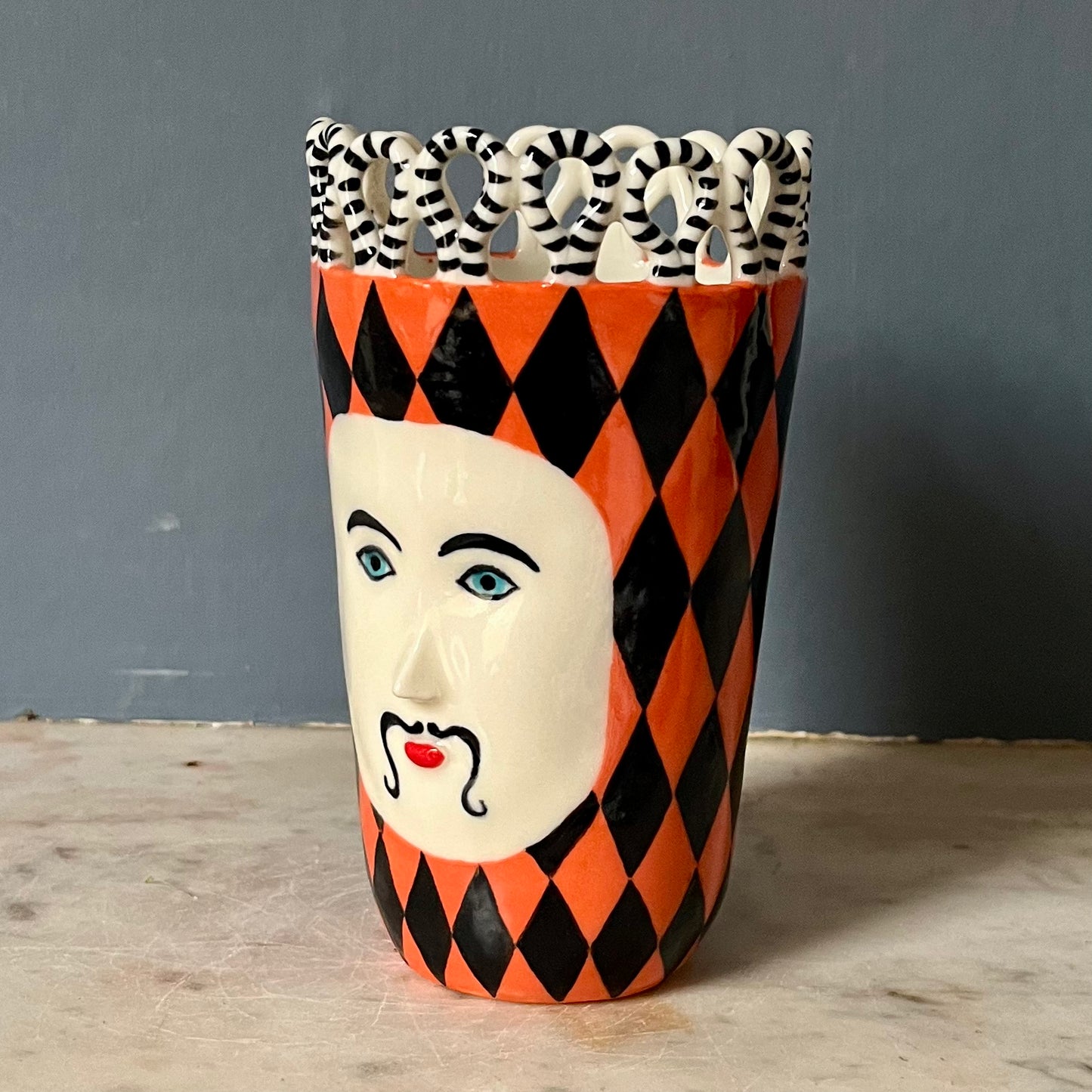 Orange and Black Harlequin Man