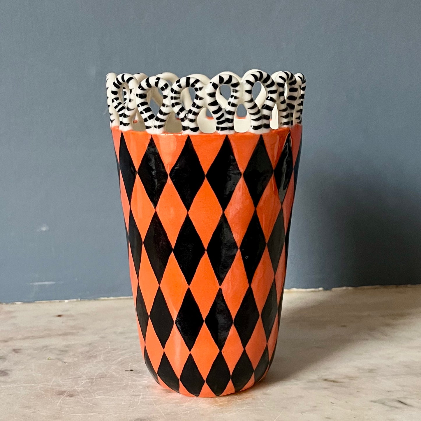 Orange and Black Harlequin Man