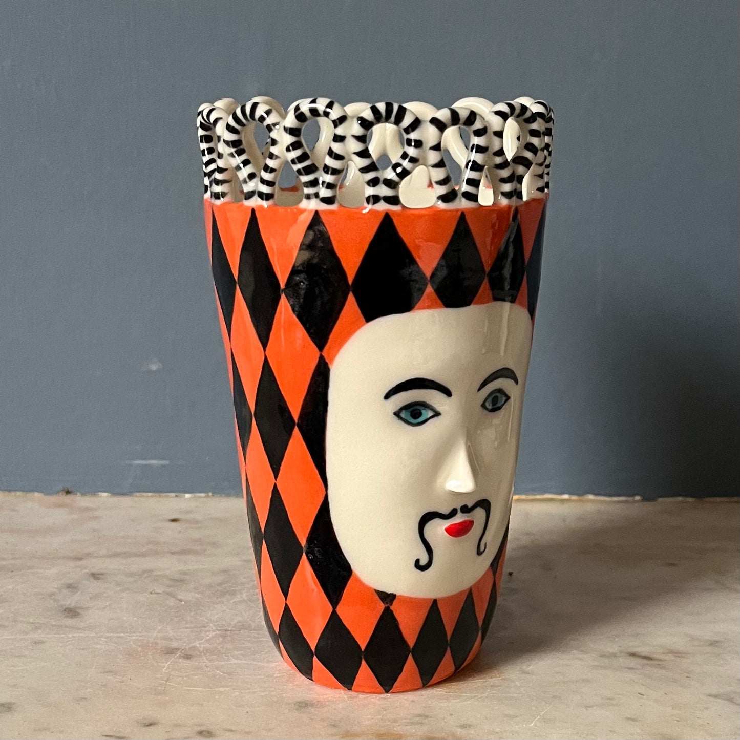 Orange and Black Harlequin Man