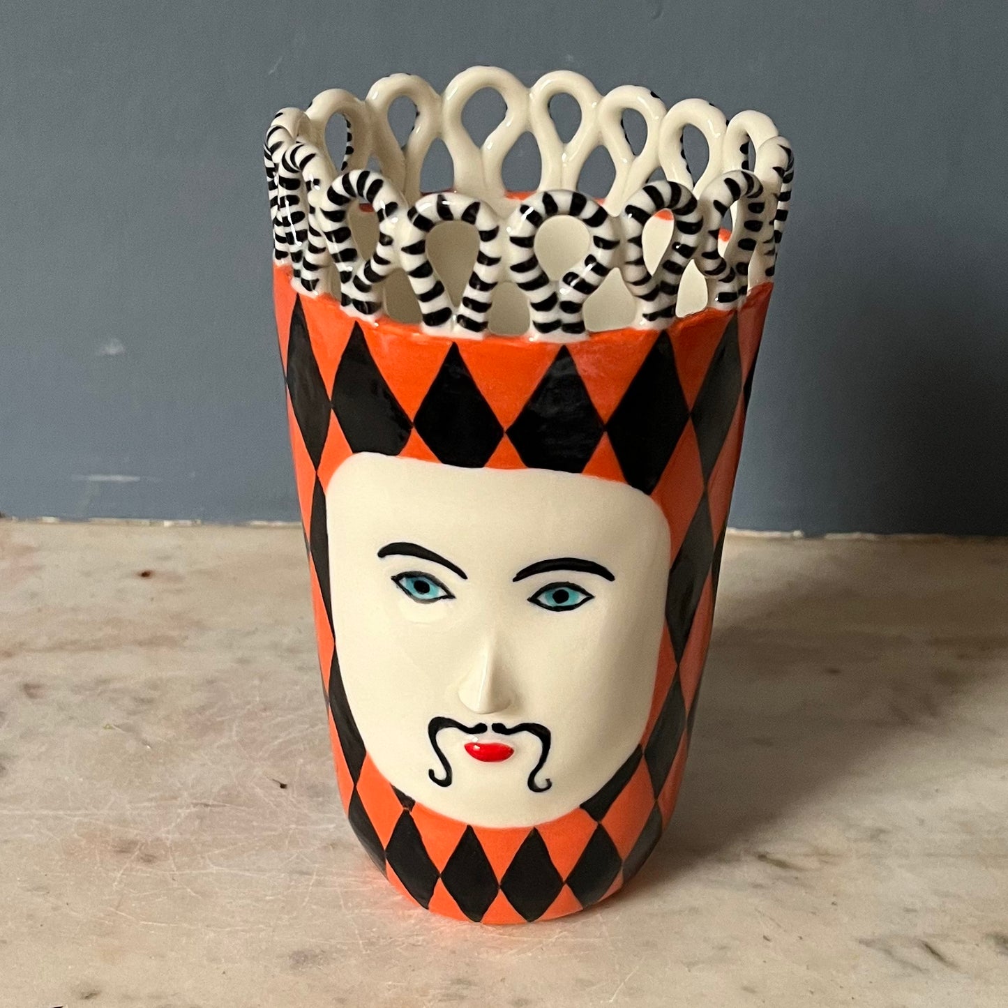 Orange and Black Harlequin Man