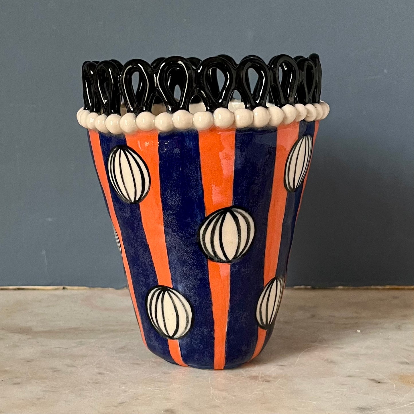 Black Droplet Crown with Painted Baubles on Orange and Blue Stripes