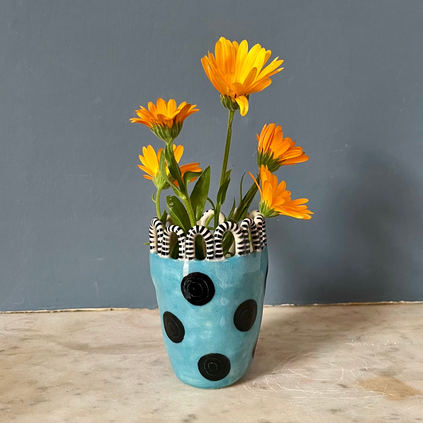 Turquoise Lady with Black Spots and Stripy Looped Crown