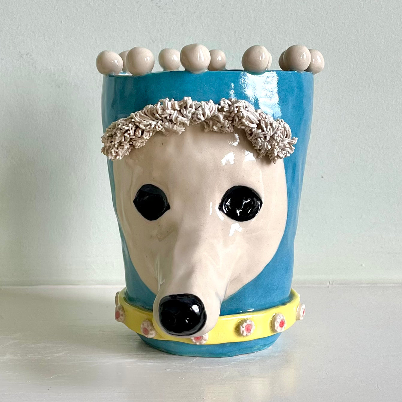 Poodle in Turquoise Balaclava with Yellow Jewelled Collar