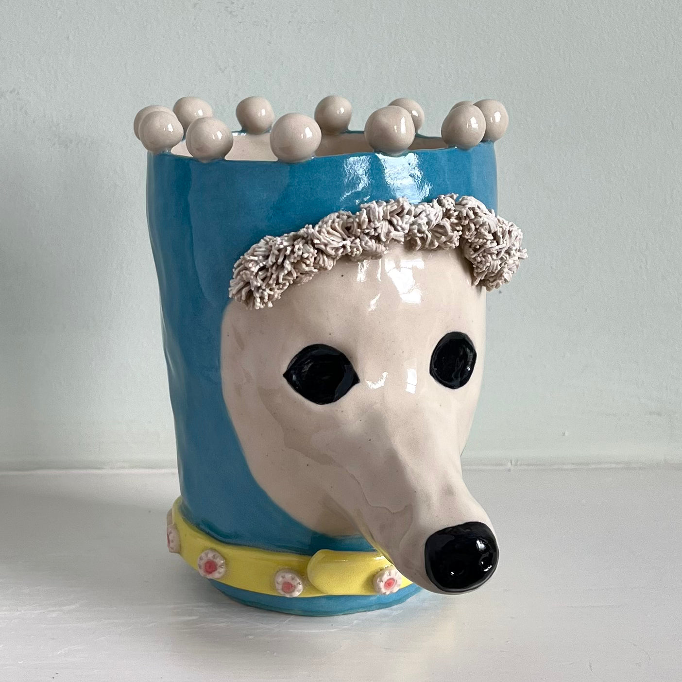 Poodle in Turquoise Balaclava with Yellow Jewelled Collar