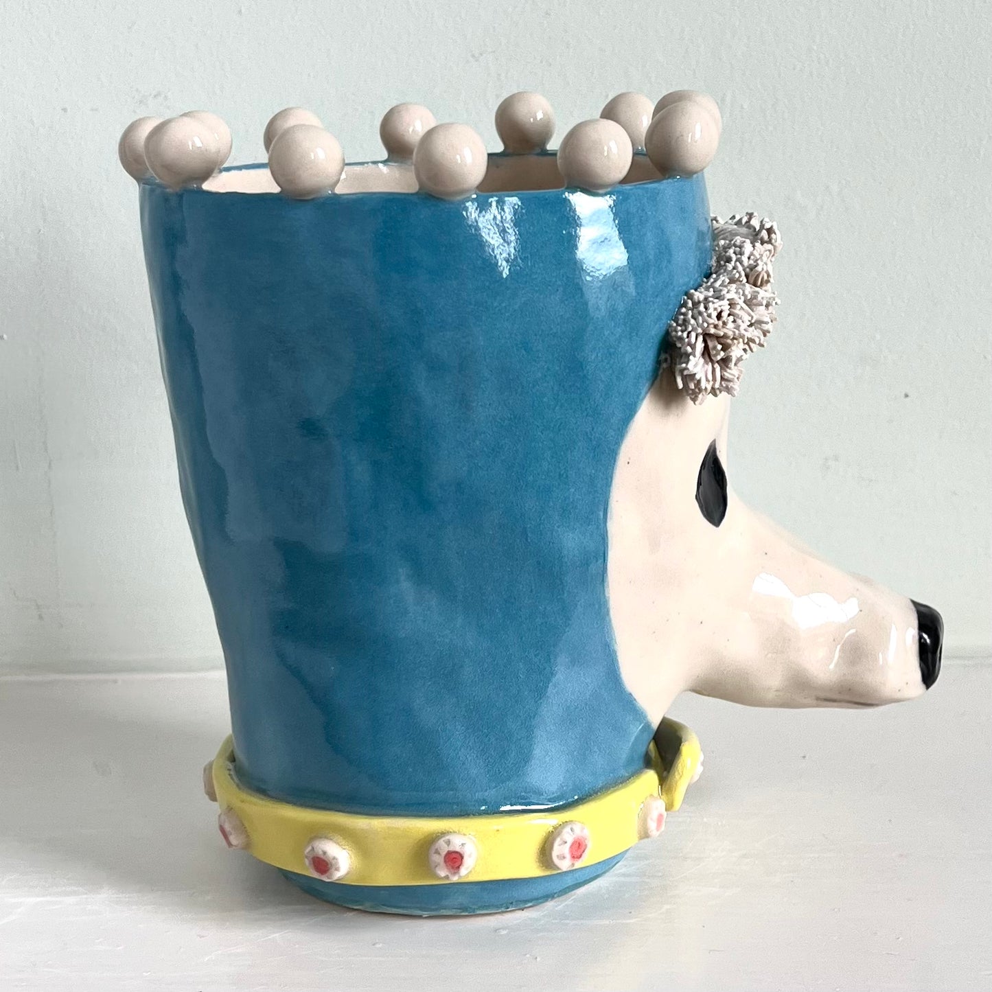 Poodle in Turquoise Balaclava with Yellow Jewelled Collar