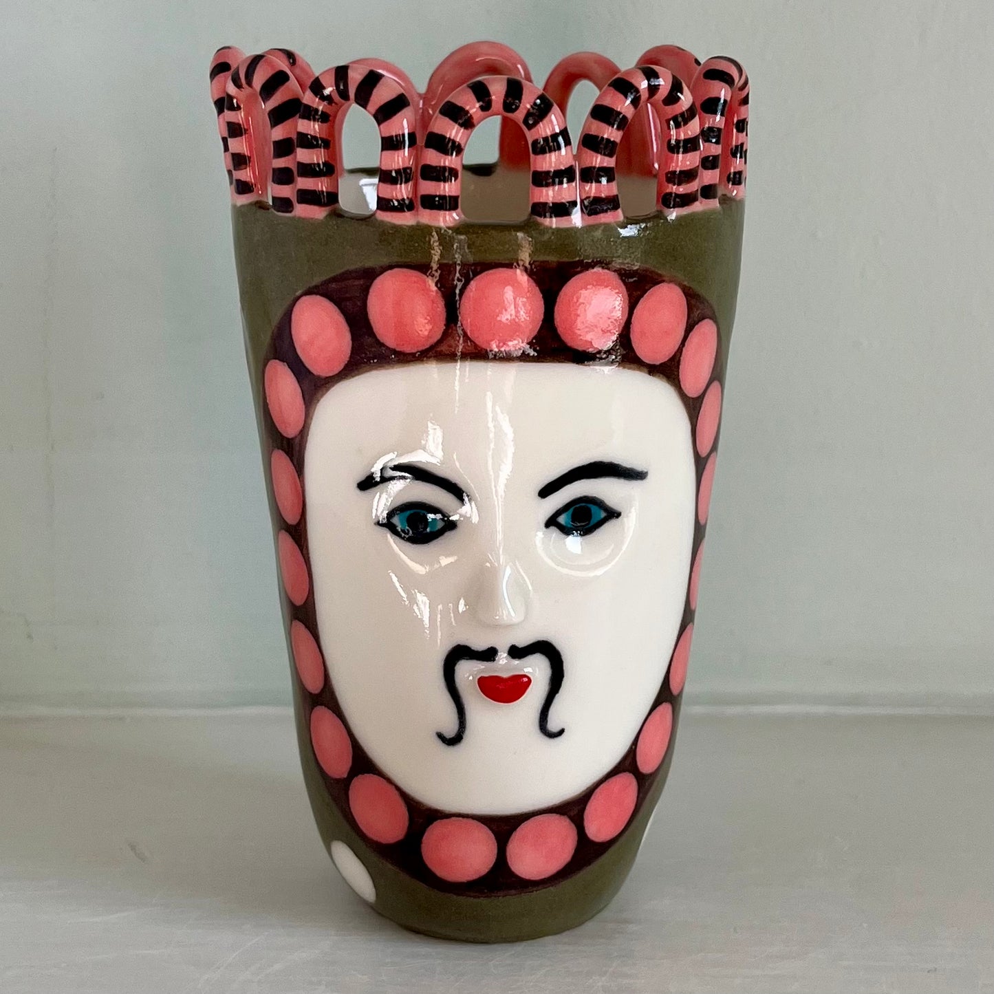 Green Man with Pink and Chocolate Brown Surround, and White Spots