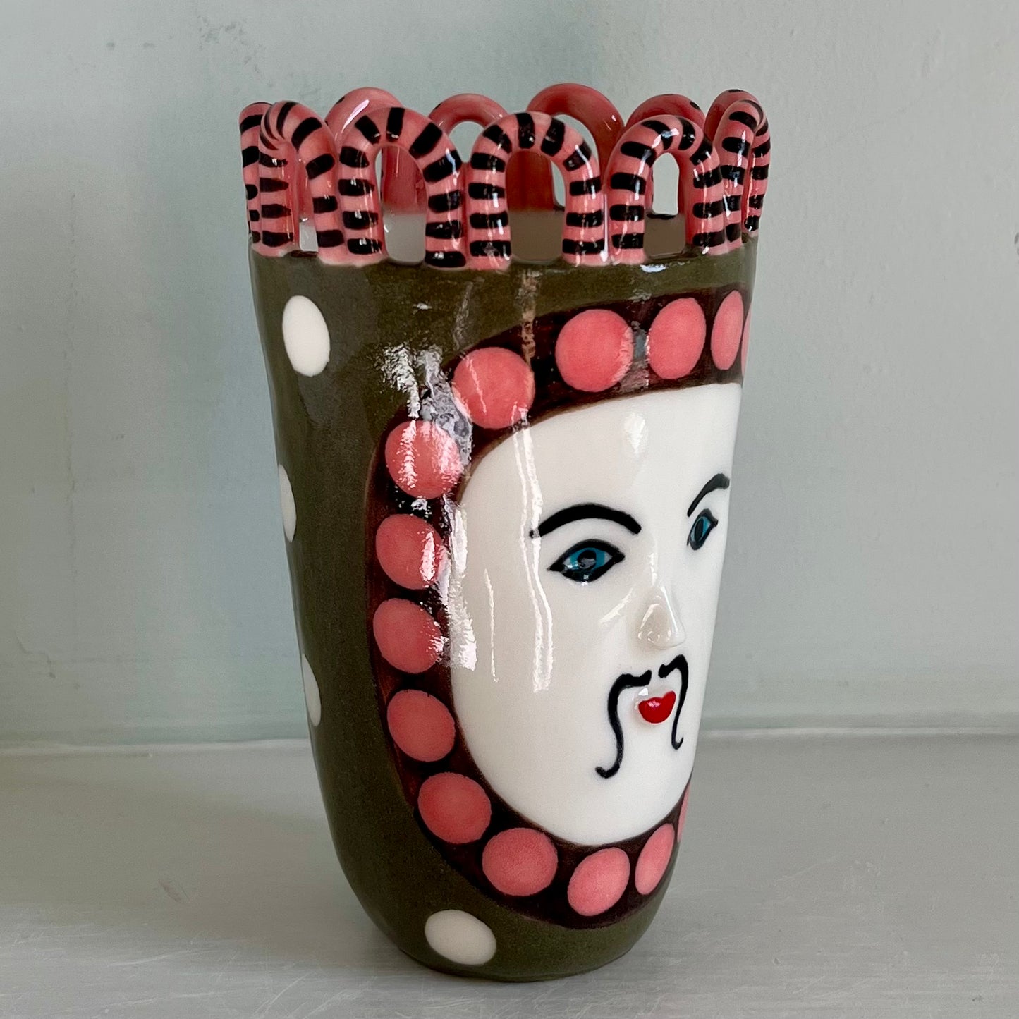 Green Man with Pink and Chocolate Brown Surround, and White Spots