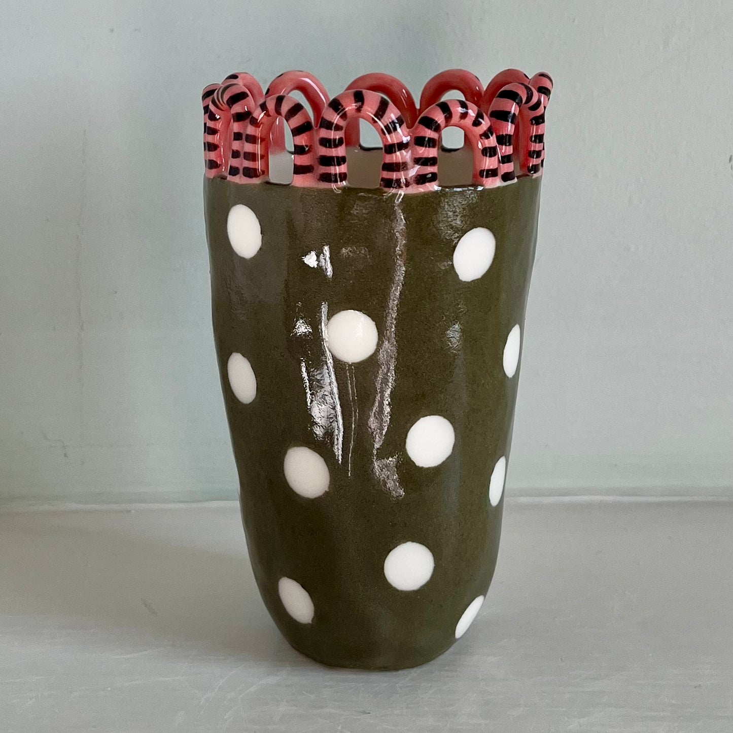 Green Man with Pink and Chocolate Brown Surround, and White Spots