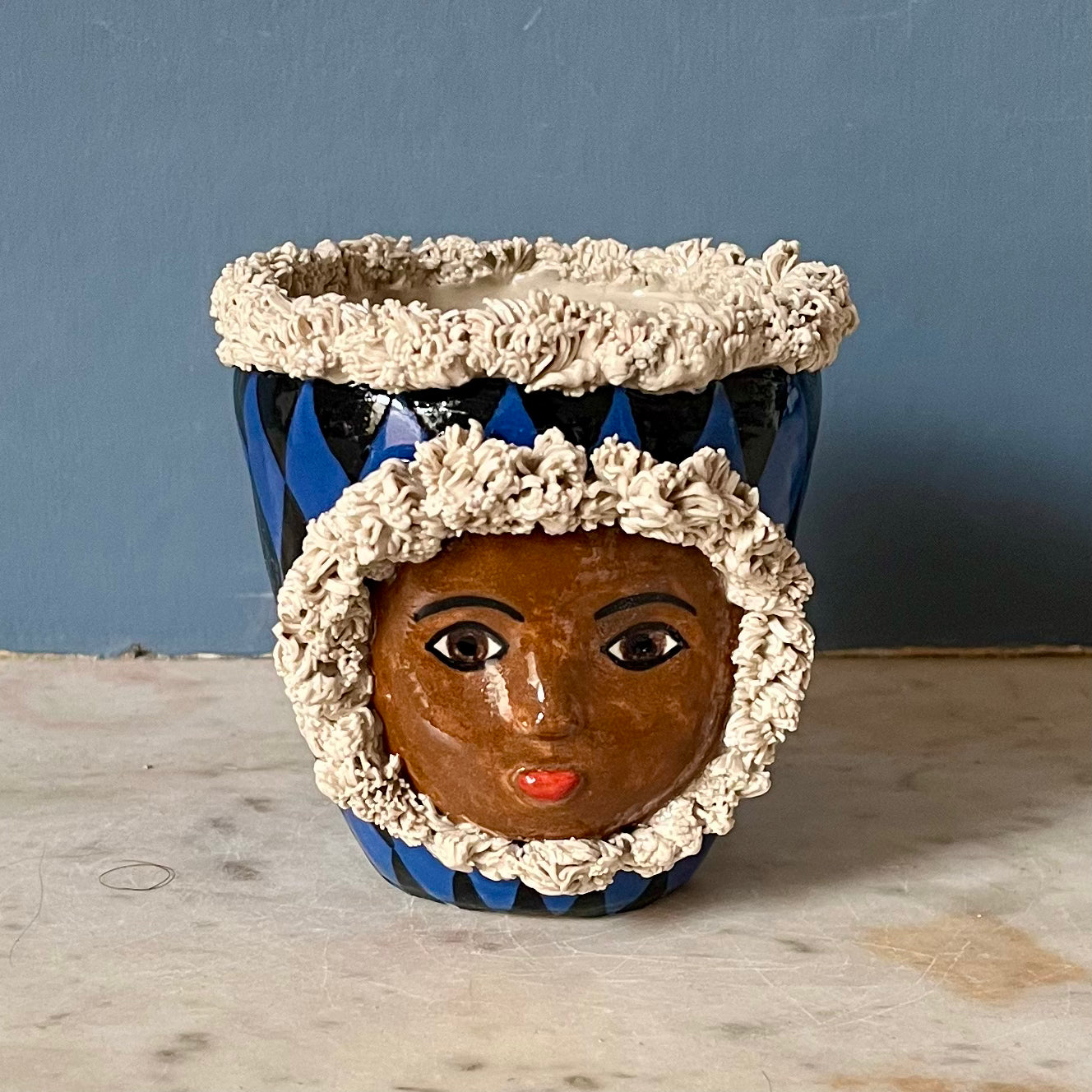 Blue and Black Harlequin with Fur Hood and Crown