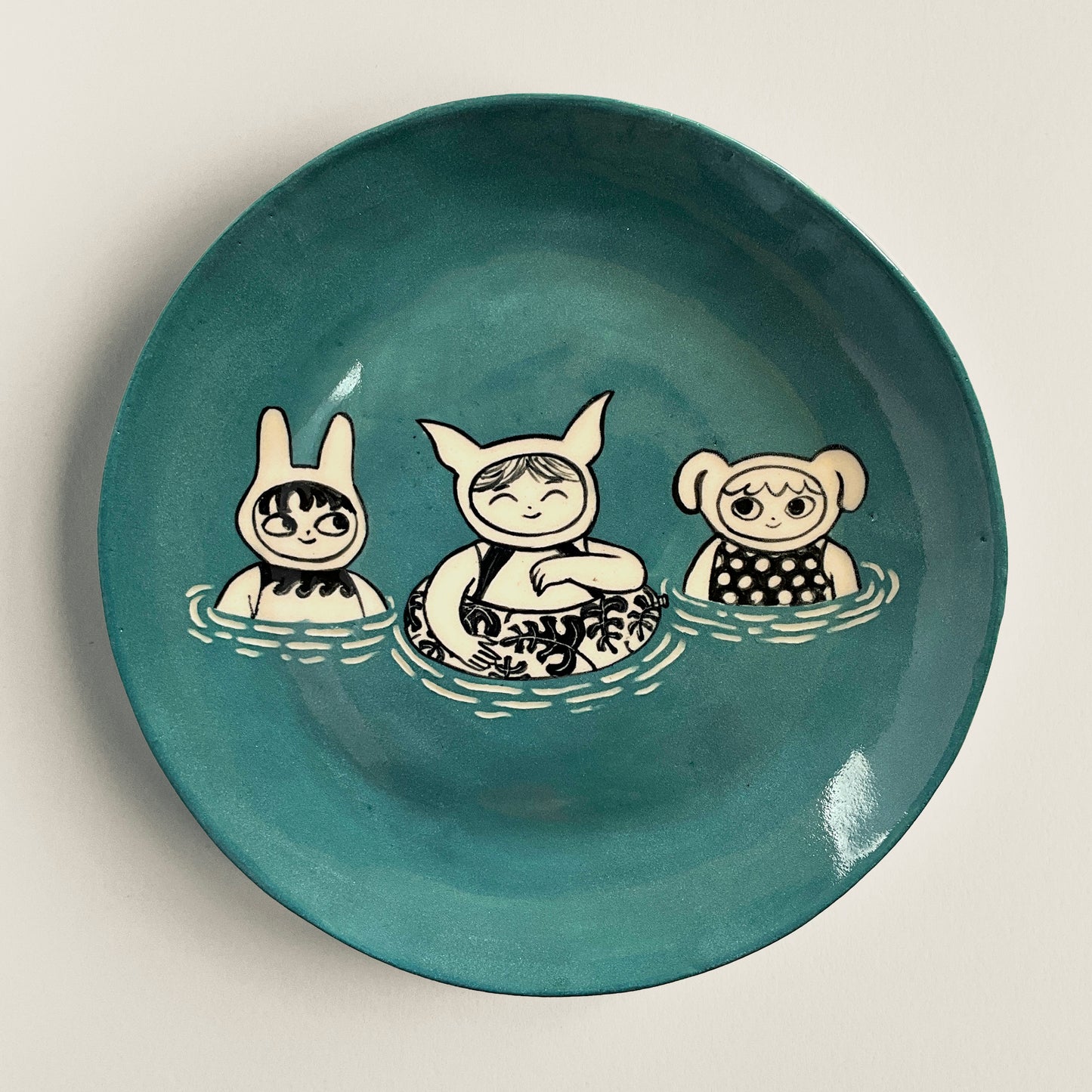 Water Babies Bobbing in Muted Blue Sea plate